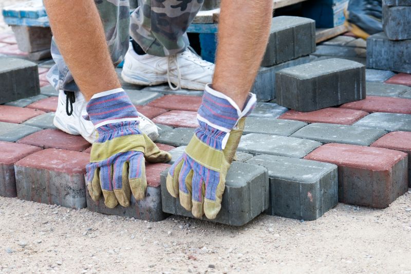 Pavers being carefully placed